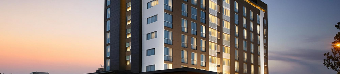 Luxury hotel exterior at sunset